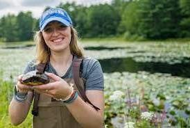 student holding turtle